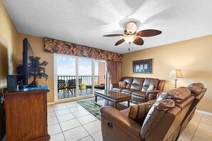 Flat-screen TV, DVD player, books, video library