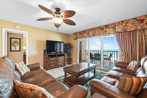 Flat-screen TV, DVD player, books, video library