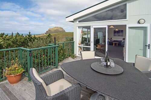 Castlepoint - Maison familiale privée sur la plage avec une vue imprenable sur le soleil.