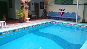 Outdoor pool, open 8 AM to 9 PM, pool umbrellas, pool loungers