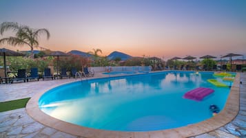 Seasonal outdoor pool, pool umbrellas, pool loungers