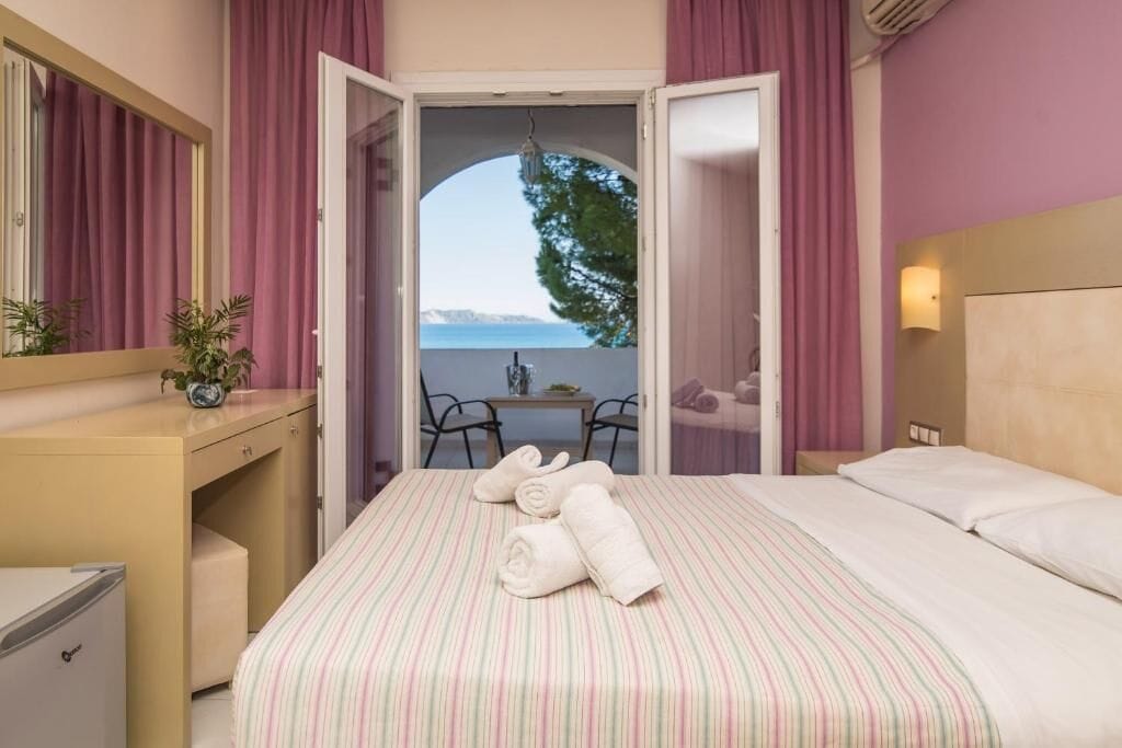 Standard Room, Sea View | Minibar, in-room safe, free WiFi, bed sheets