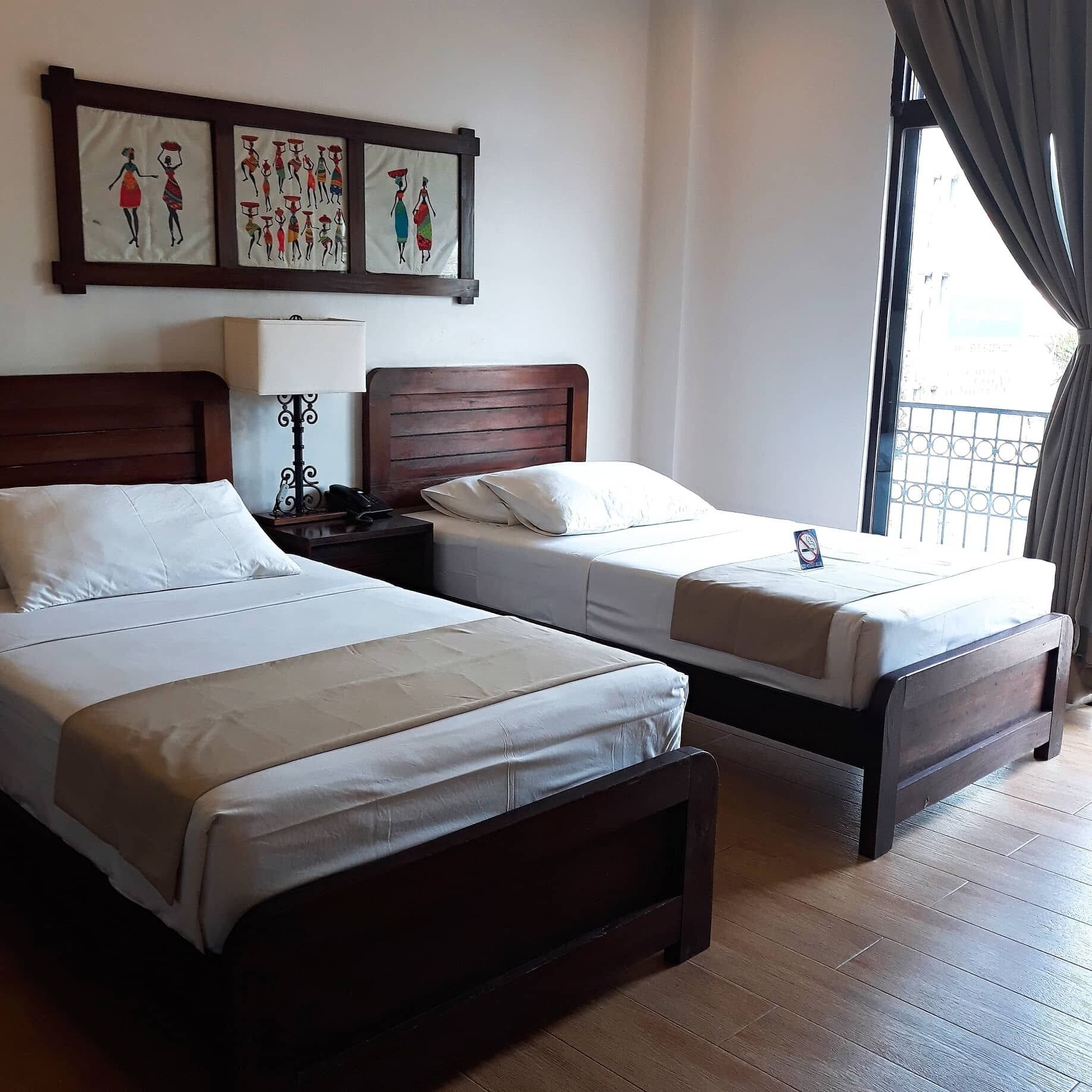 superior deluxe twin | premium bedding, individually decorated, desk, laptop workspace