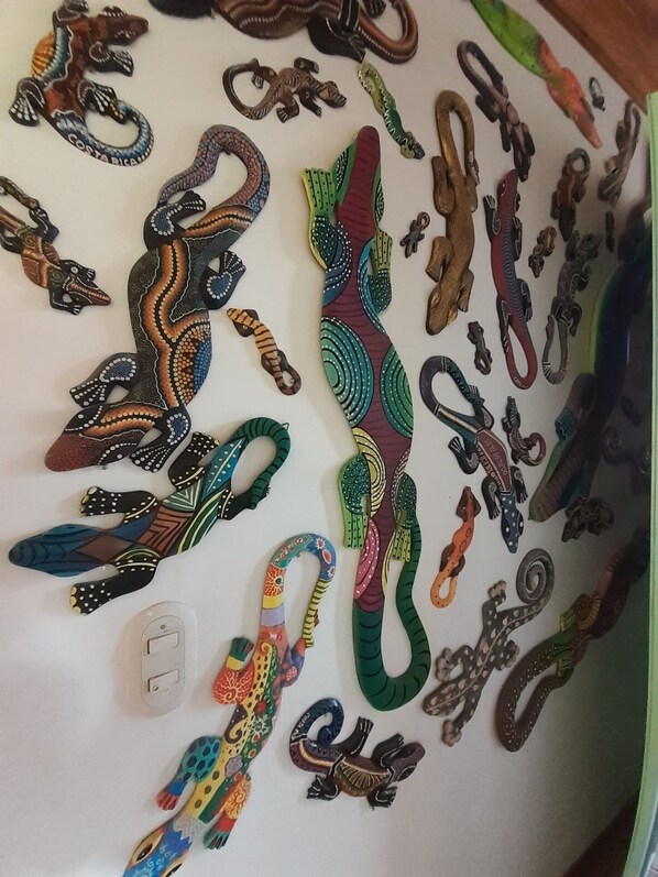 A collection of colorful, intricately designed metal keychains.