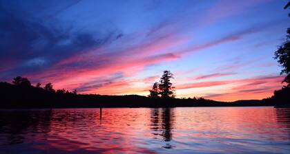 Spacious Sebago Lake waterfront house with game room, hot tub, and covered deck.