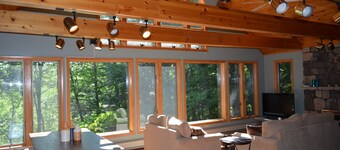 Spacious Sebago Lake waterfront house with game room, hot tub, and covered deck.