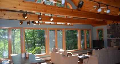 Spacious Sebago Lake waterfront house with game room, hot tub, and covered deck.
