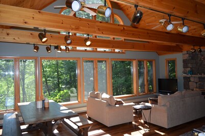 Spacious Sebago Lake waterfront house with game room, hot tub, and covered deck.