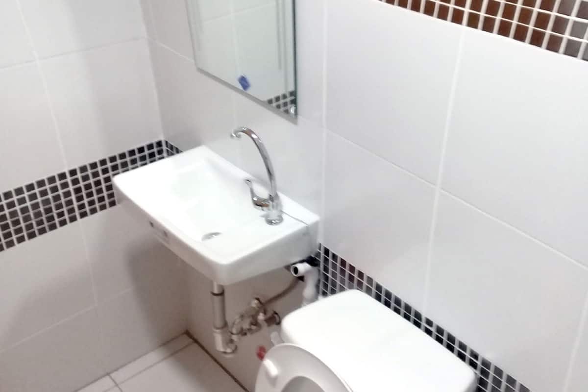 shower, hair dryer, slippers, bidet