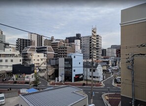 A cityscape with various buildings, including a police station and a KUBO BUILDING. - HOTEL -sui- HARUYOSHI (Fukuoka)