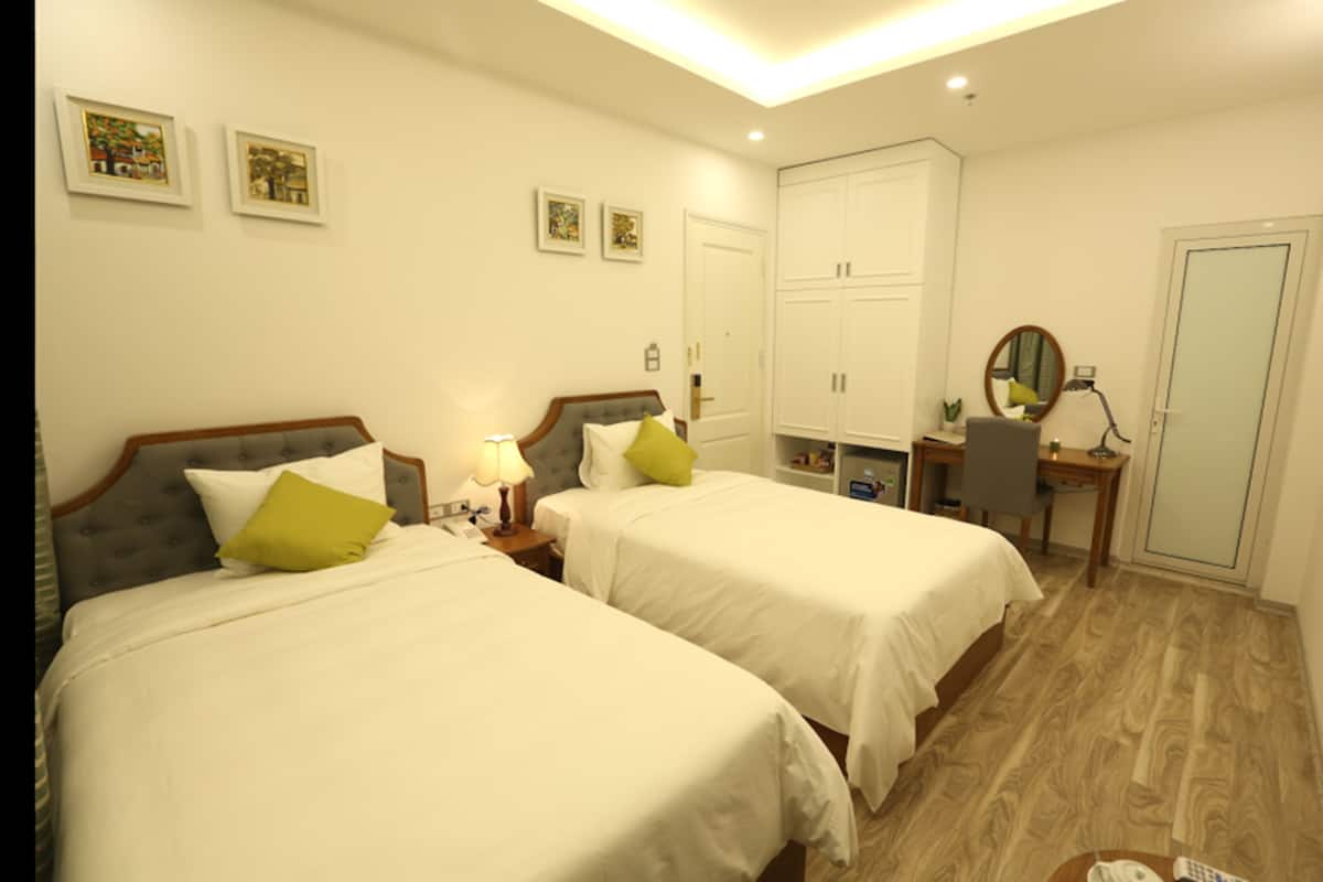 Standard Twin Room | Minibar, in-room safe, desk, blackout curtains
