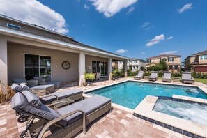 A residential pool area with lounge chairs and a hot tub. - Aco245706 - The Encore Club Resort - 8 Bed 8 Baths Villa (Kissimmee)