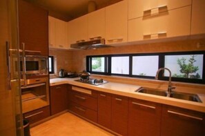 Villa | Private kitchen | Fridge, microwave, stovetop, rice cooker