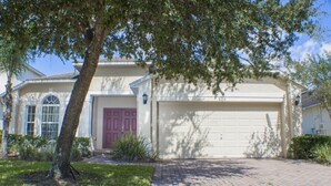 A single-story house with a garage, a front door, and a driveway. - Ip60305 - Highgate at Legacy Park - 4 Bed 3 Baths Villa (Davenport)