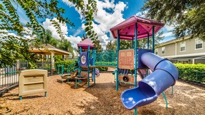 A playground with a slide, climbing structures, and a covered play area. - Fv51890 - Crystal Cove - 4 Bed 3 Baths Villa (Kissimmee)
