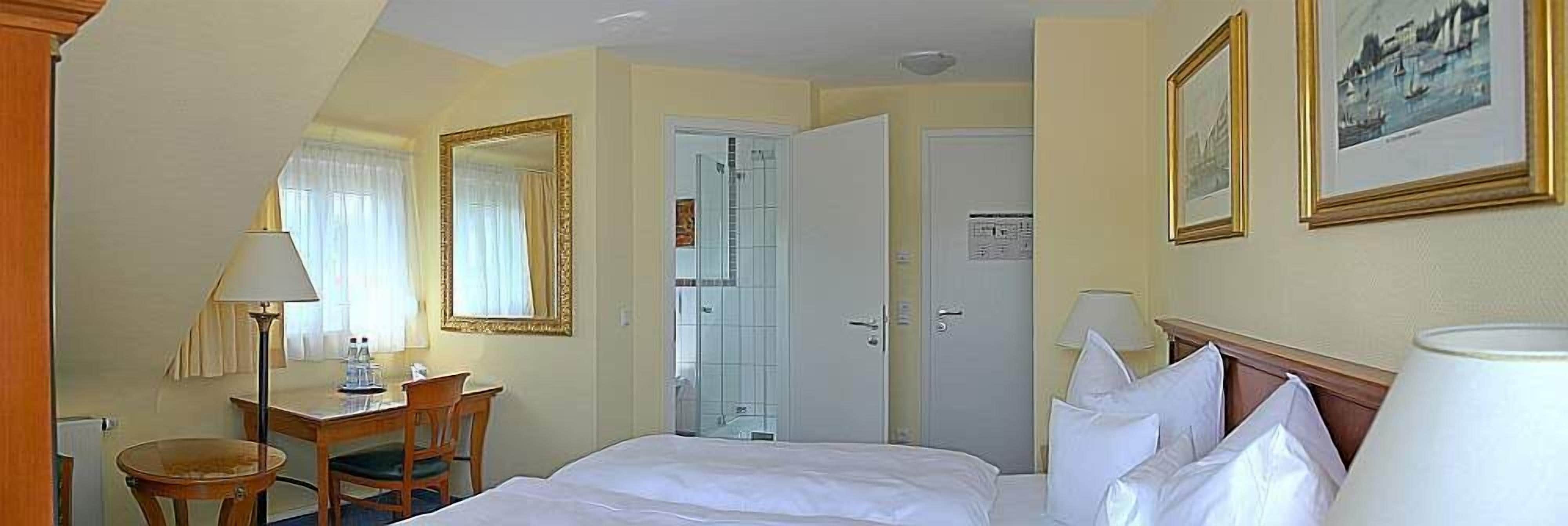 hypo-allergenic bedding, in-room safe, desk, blackout curtains