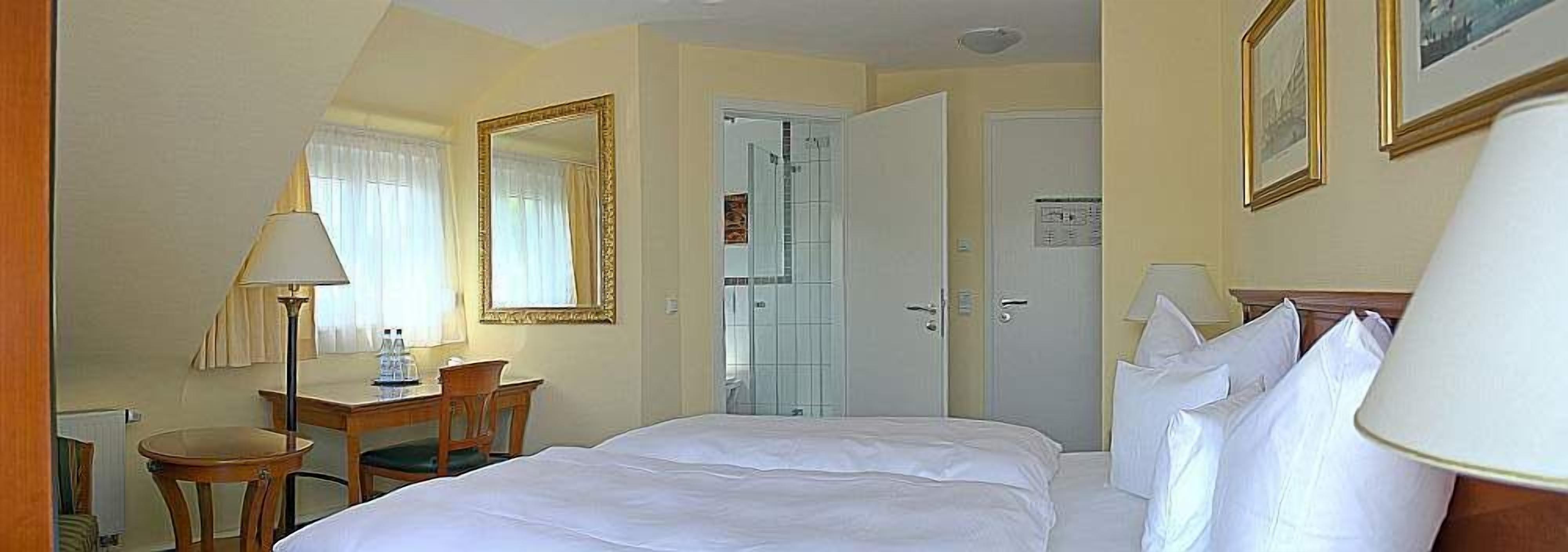 hypo-allergenic bedding, in-room safe, desk, blackout curtains