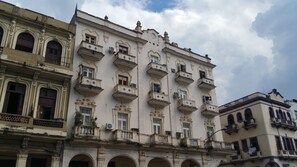 A historic building with ornate balconies and arched windows. - Jerome's Old Havana Apartment (Havana)