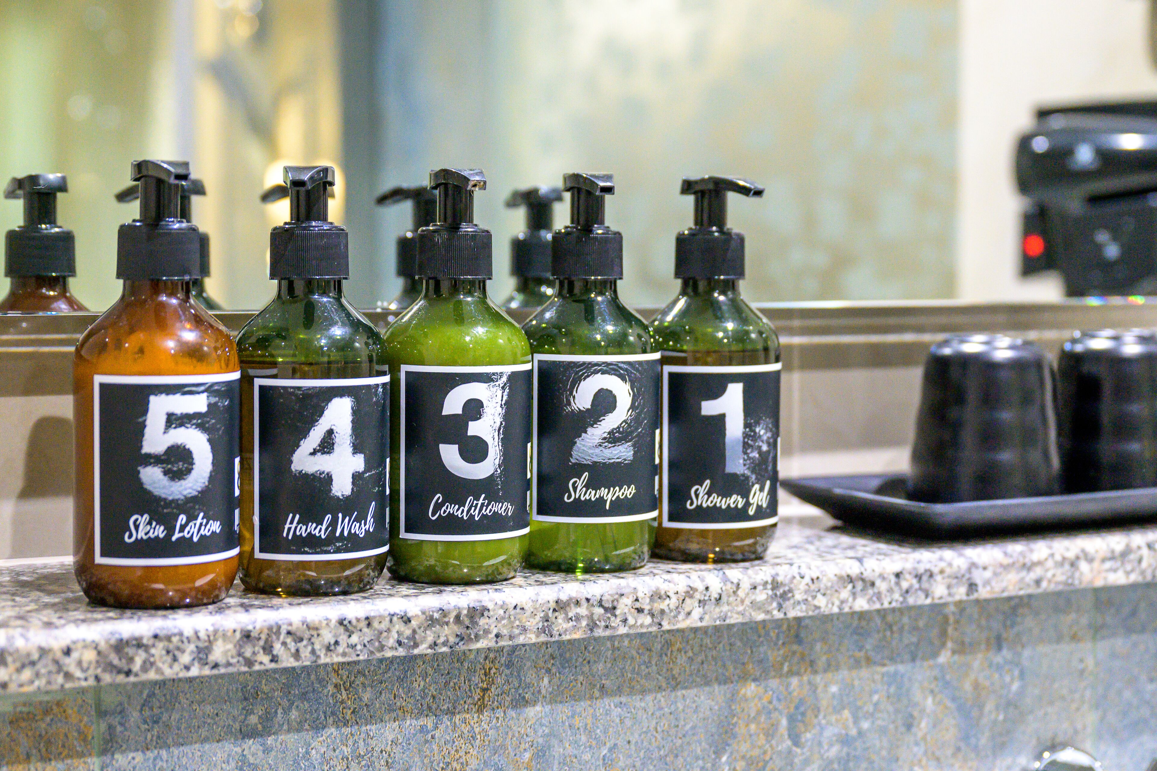 A row of toiletries on a countertop.