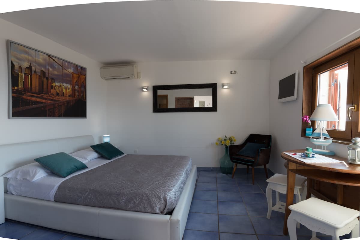 Economy Quadruple Room | Minibar, desk, free WiFi, bed sheets