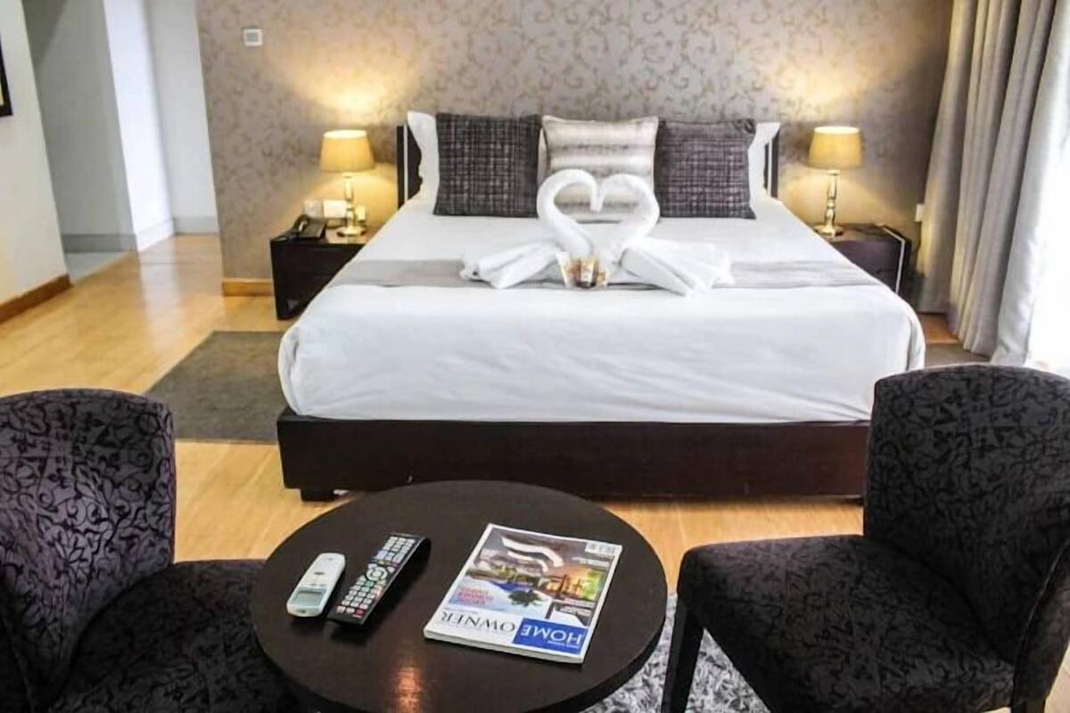 Premium bedding, desk, laptop workspace, blackout curtains