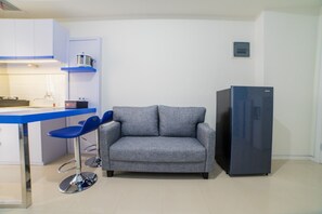 Habitación | Área de sala de estar | Televisión 