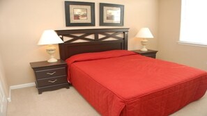 A bedroom with a bed, two bedside tables, and two wall-mounted lamps. - Tr314 - Terrace Ridge - 2 Bed 2 Baths Condo (Davenport)