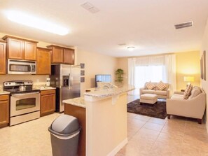 Family Villa, Hot Tub, Garden Area | Shared kitchen | Fridge, microwave, oven