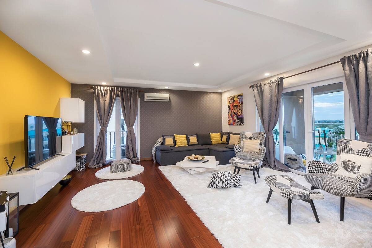Deluxe Apartment, 2 Bedrooms, Pool Access, Pool View | Living room | 160-cm Smart TV with digital channels, TV, fireplace