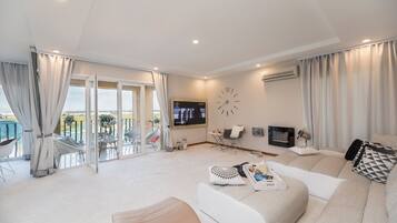 Premium Apartment, 2 Bedrooms, Non Smoking, Balcony | Living room | 160-cm Smart TV with digital channels, TV, fireplace