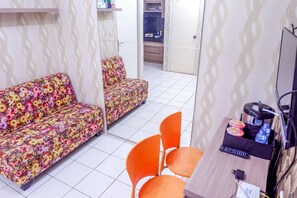 Habitación | Área de sala de estar | Televisión 