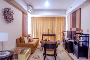 Room | Living room | TV - Cozy Pool View Kemang Village Residence Apartment with Direct Access to Mall (Jakarta)