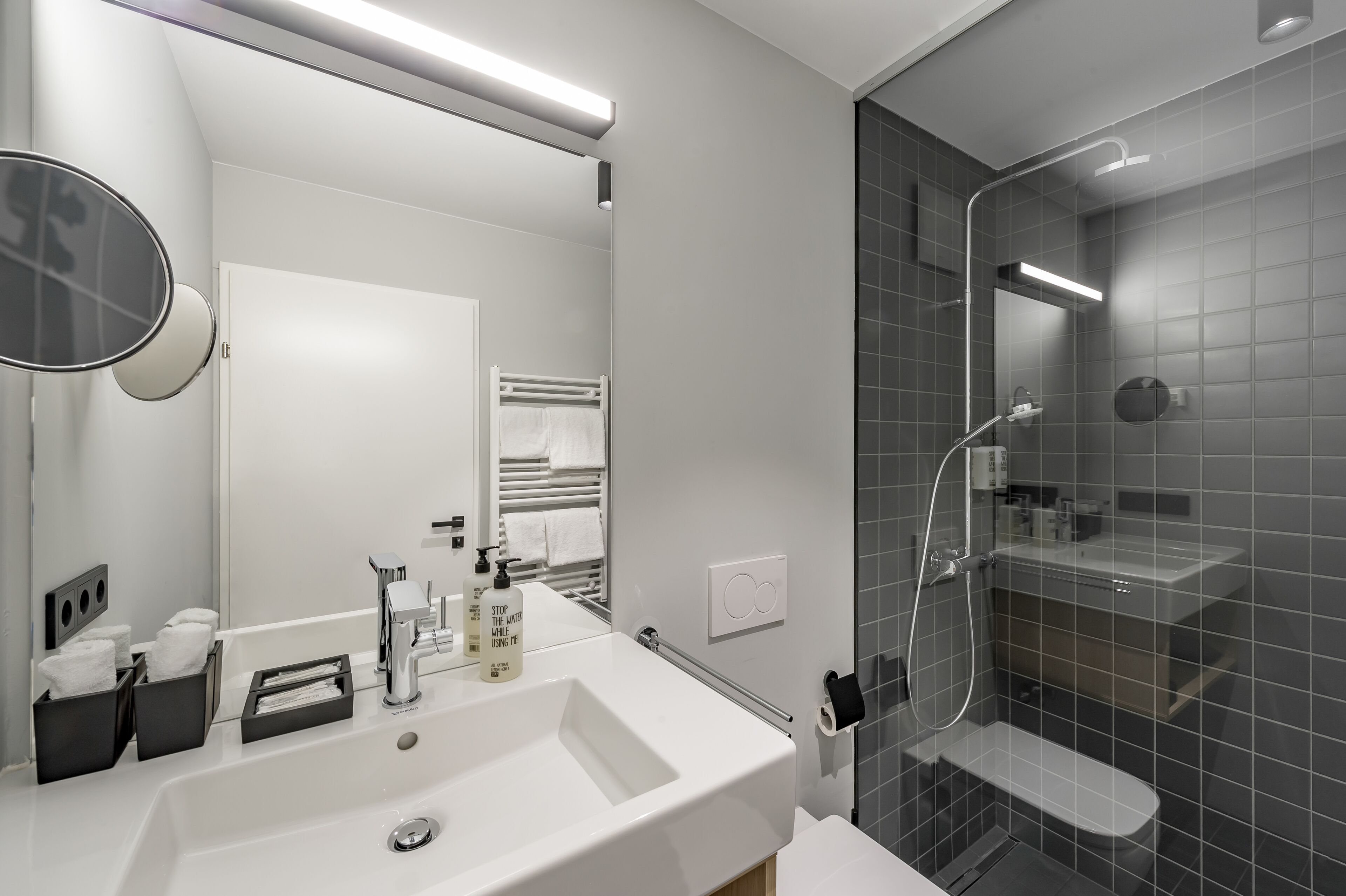 superior double room | bathroom | shower, hair dryer, towels