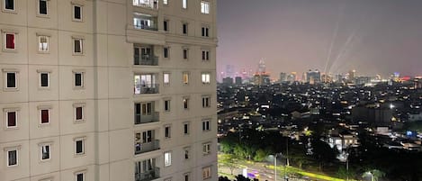 A multi-story building with balconies and windows.