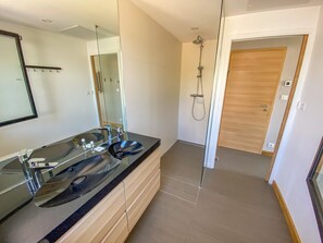 Shower, rainfall showerhead, hair dryer, towels