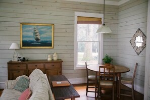 Magnolia Cottage | Living area | 42-inch flat-screen TV with premium TV channels, TV, fireplace - Ball House and Cottages (Tallahassee)