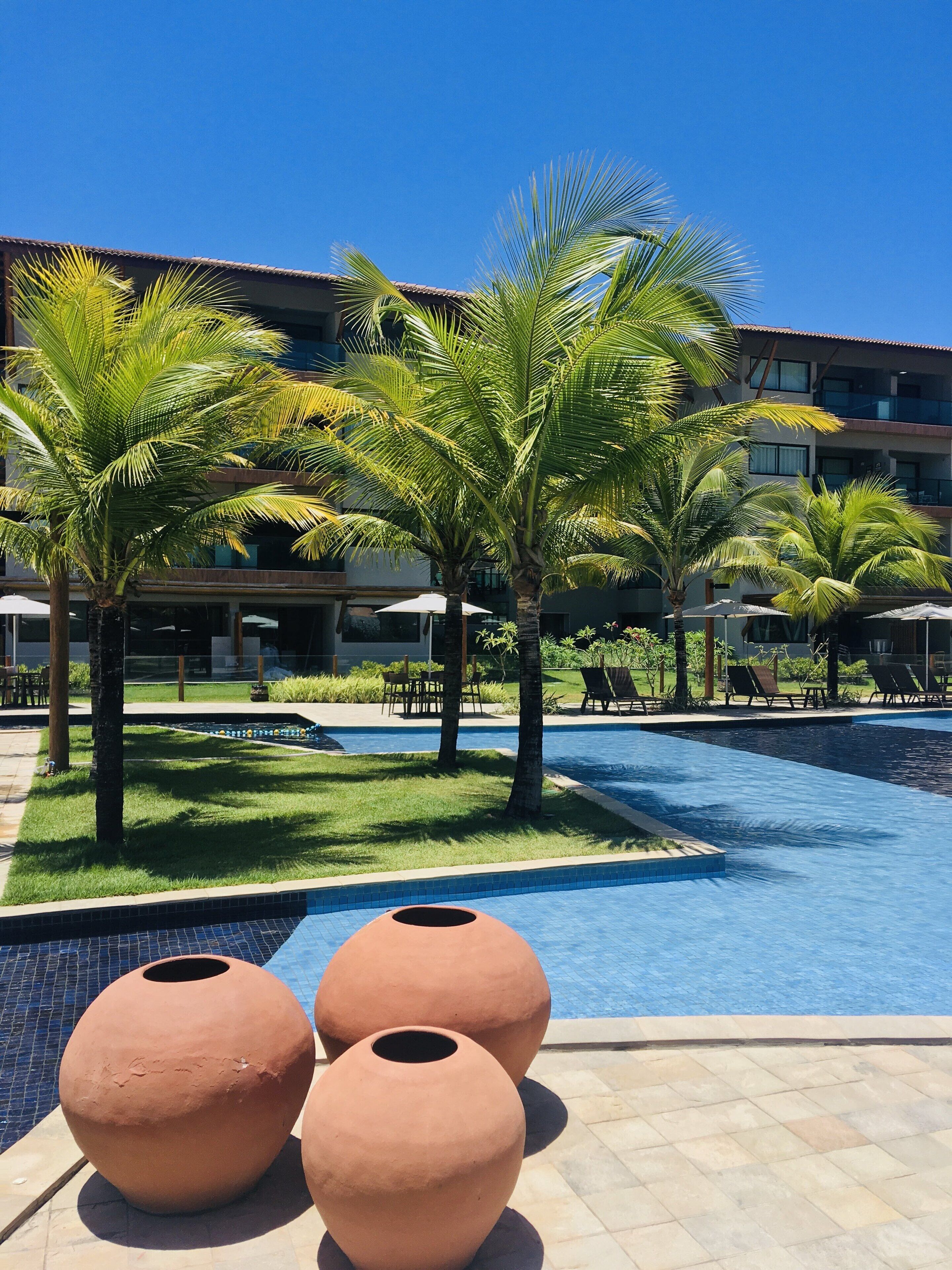 outdoor pool, open 7 am to 9 pm, pool umbrellas, pool loungers