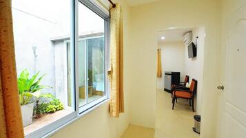 Deluxe Double Room | Living area | Flat-screen TV