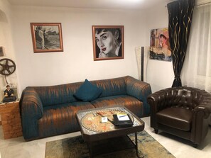 Apartment, 1 King Bed | Living room | 55-inch flat-screen TV with satellite channels, TV, DVD player - Hotel Karthaeuser Hof (Floersheim)