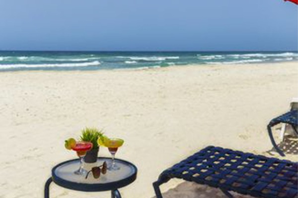 On the beach, white sand, free beach cabanas, sun loungers