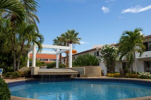 Outdoor pool, open 10 AM to 6 PM, pool umbrellas, sun loungers