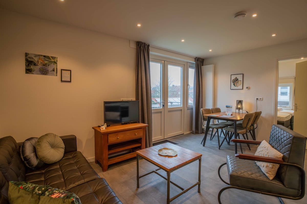 Appartement, balkon (Heivlinder) | Woonkamer | Flatscreentelevisie