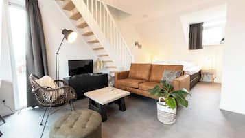 Appartement ( Eikenpage ) | Een kluis op de kamer, een strijkplank/strijkijzer, babybedden