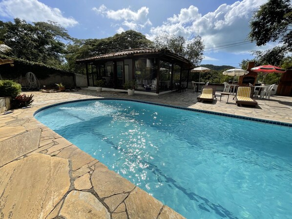 Outdoor pool, open 8:00 AM to 8:00 PM, pool umbrellas, pool loungers