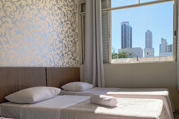 Economy Triple Room | Laptop workspace, blackout drapes, WiFi (free), bed sheets
