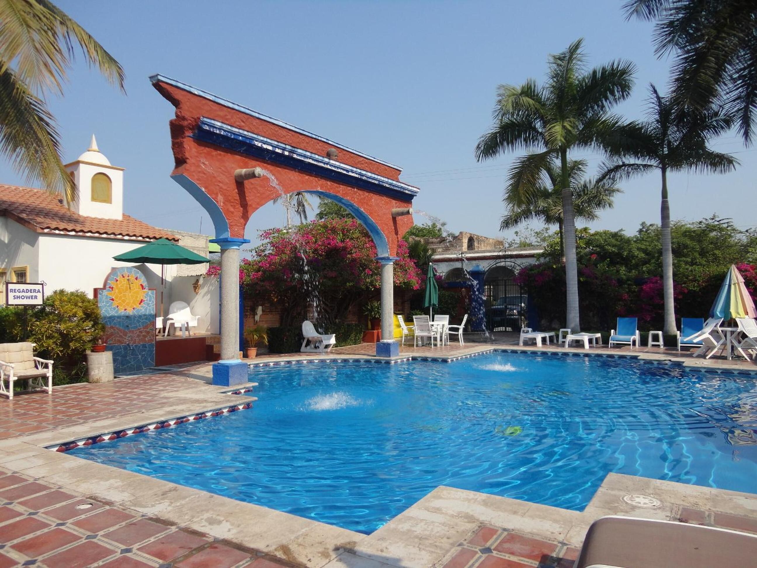 outdoor pool, open 8 am to 9 pm, pool umbrellas, pool loungers