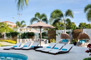 Outdoor pool, pool umbrellas, sun loungers