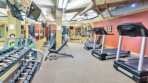 A gym with treadmills, dumbbells, and exercise equipment. - River Run Village 2 Bedroom Condo - 100 yards to slopes, Pool, Hot Tub Access (Keystone)