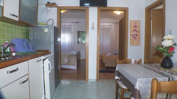 Apartment, 2 Bedrooms, Balcony (A4) | Living area | Flat-screen TV