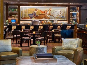 A bar area with leather chairs, a bar counter, and a large mural depicting a horse and rider. - Aspen St Regis Residence Club 3 Bedroom (Aspen)
